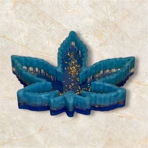 La feuille de chanvre bleu au pépites d'or